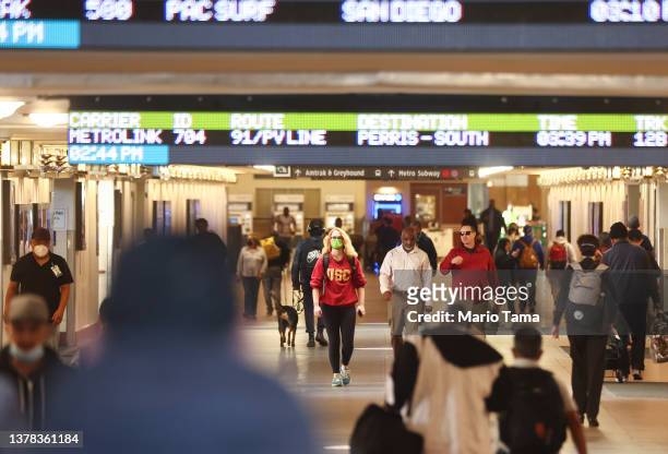 People walk through Union Station on March 3, 2022 in Los Angeles, California. Los Angeles County is expected to drop its indoor mask mandate...