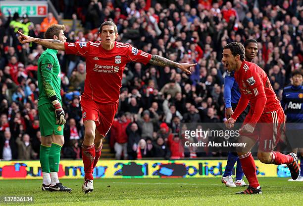 Daniel Agger of Liverpool celebrates scoring the opening goal with Maxi during the FA Cup Fourth Round match between Liverpool and Manchester United...