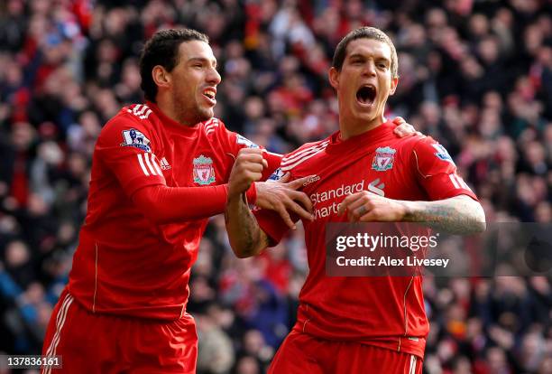 Daniel Agger of Liverpool celebrates scoring the opening goal with Maxi during the FA Cup Fourth Round match between Liverpool and Manchester United...