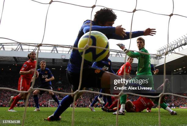 Rafael of Manchester United is unable to prevent Daniel Agger of Liverpool scoring the opening goal during the FA Cup Fourth Round match between...