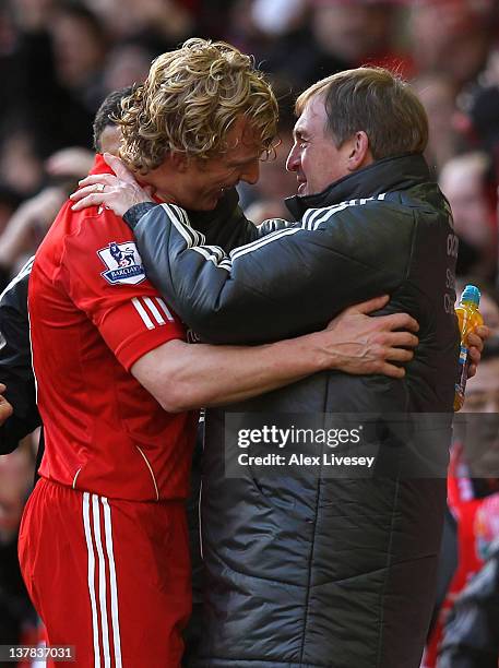 Liverpool Manager Kenny Dalglish embraces Dirk Kuyt at the end of the FA Cup Fourth Round match between Liverpool and Manchester United at Anfield on...