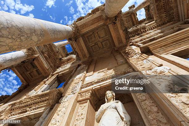 low angle view of the library of celus in ephesus, turkey - ancient marble statues greek stock pictures, royalty-free photos & images