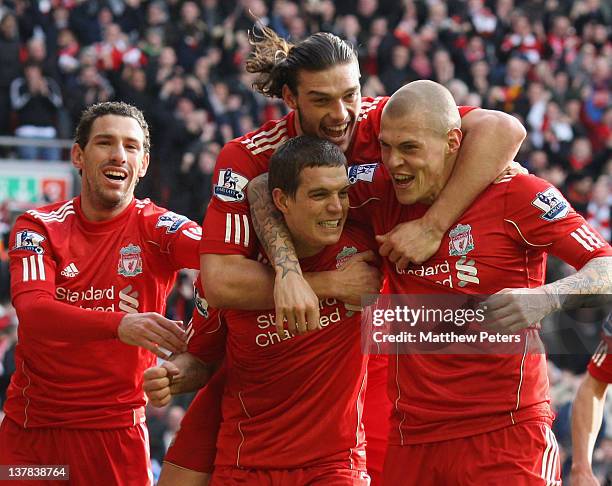 Daniel Agger of Liverpool celebrates scoring their first goal during the FA Cup Fourth Round match between Liverpool and Manchester United at Anfield...