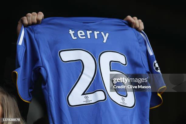 Fan holds up the number 26 shirt worn by John Terry of Chelsea during the FA Cup with Budweiser Fourth Round match between Queens Park Rangers and...