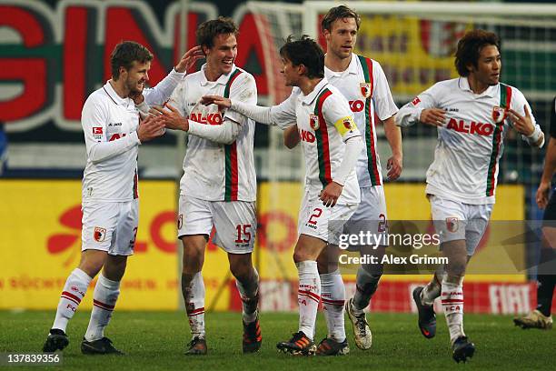 Stephan Hain of Augsburg celebrates his team's second goal with team mates during the Bundesliga match between FC Augsburg and 1. FC Kaiserslautern...