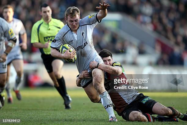 Sam Harrison of Leicester Tigers is tackled during the LV= Cup match between Harlequins and Leicester Tigers at Twickenham Stoop on January 28, 2012...