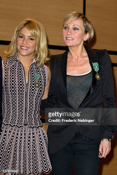 Shakira and Patricia Kaas pose for the cameras after being honored by French Minister of Culture Frederic Mitterand in at Hotel Majestic on January...