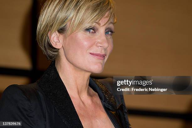 Singer Patricia Kaas smiles while being honored by French Minister of Culture Frederic Mitterand during MIDEM 46th Edition at Hotel Majestic on...