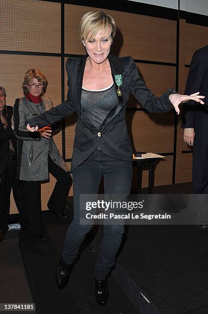 Patricia Kaas poses after being honored by French culture Minister Frederic Mitterand at Hotel Majestic on January 28, 2012 in Cannes, France.