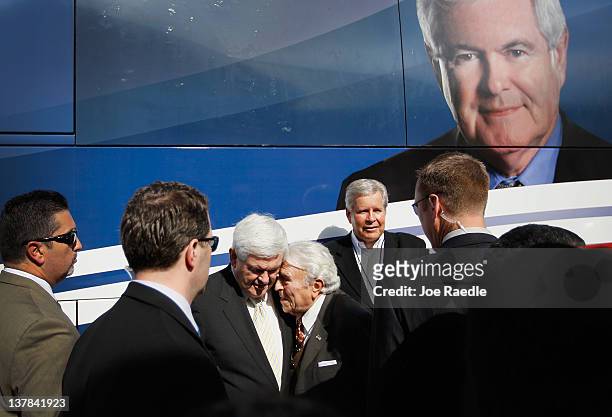 Former U.S. Rep. Benjamin Gilman speaks with Republican presidential candidate, former Speaker of the House Newt Gingrich during a meet and greet at...