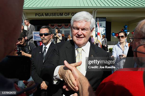 Republican presidential candidate, former Speaker of the House Newt Gingrich greets people during a meet and greet at the PGA Center for Golf...