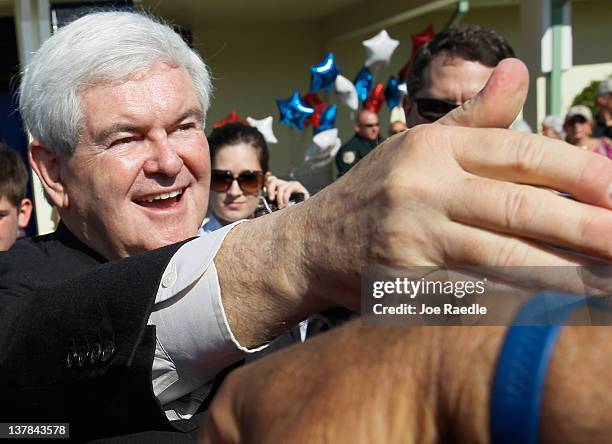 Republican presidential candidate, former Speaker of the House Newt Gingrich greets people during a meet and greet at the PGA Center for Golf...