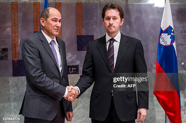 Janez Jansa, Slovenian Prime Minister shakes hands with Gregor Virant , president of Slovenian Parliament after Jansa was elected by members of...