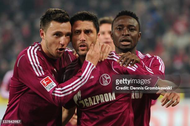 Ciprian Marica of Schalke celebrates with teammates after scoring his team's first goal during the Bundesliga match between 1. FC Koeln and FC...