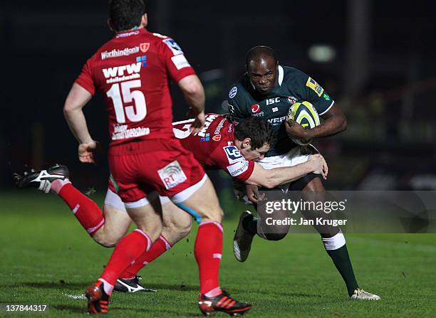 Topsy Ojo of London Irish is tackled by Adam Warren of Scarlets during the LV= Cup match between Scarlets and London Irish at Parc y Scarlets on...