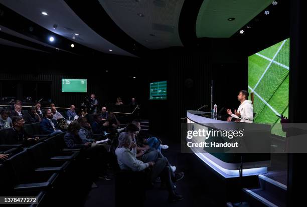 In this handout from the AELTC, Novak Djokovic of Serbia speaks to the media in a pre-tournament press conference in the Media Theatre in the...