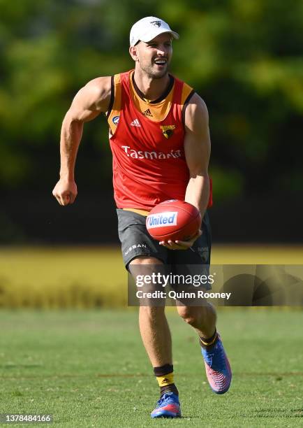 Luke Breust of the Hawks handballs during a Hawthorn Hawks AFL training session at Waverley Park on March 04, 2022 in Melbourne, Australia.