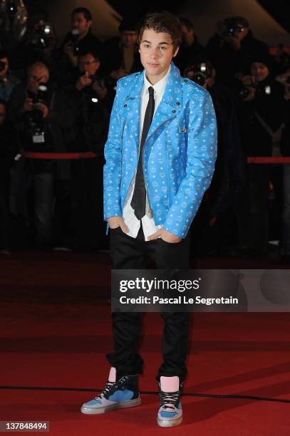 Justin Bieber poses as he arrives at NRJ Music Awards 2012 at Palais des Festivals on January 28, 2012 in Cannes, France.