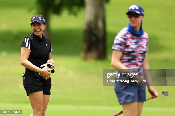 Hinako Shibuno of Japan reacts on the first fairway with Jenny Coleman of the United States during the second round of the HSBC Women's World...