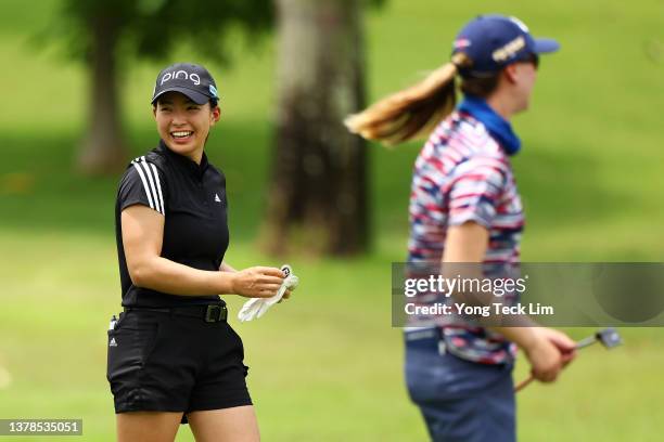 Hinako Shibuno of Japan reacts on the first fairway with Jenny Coleman of the United States during the second round of the HSBC Women's World...