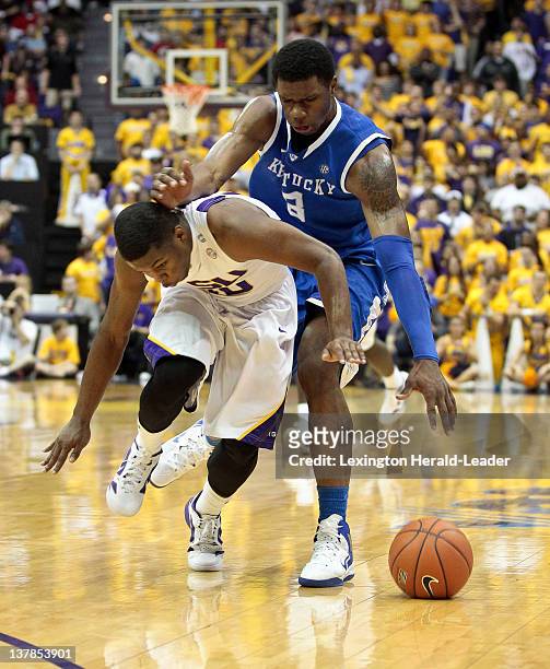 Kentucky Wildcats forward Terrence Jones and LSU Tigers guard Andre Stringer chased down a loose ball during game action at Pete Maravich Assembly...
