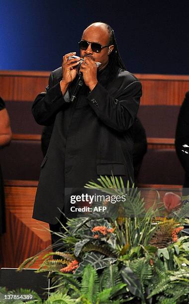 Singer Stevie Wonder performs at the Etta James' funeral, 2012 in Gardena, California, on January 28, 2012. AFP PHOTO/VALERIE MACON