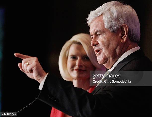 Republican presidential candidate, former Speaker of the House Newt Gingrich speaks during the Orange County Lincoln Day Dinner with his wife...