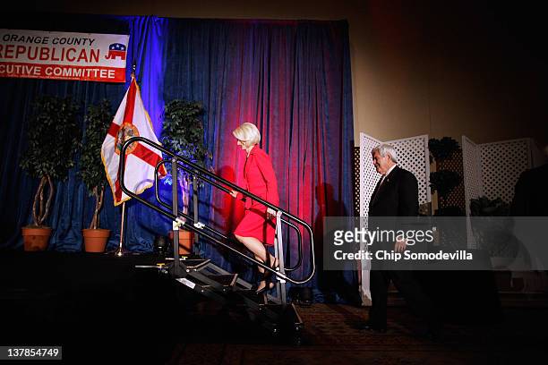 Republican presidential candidate, former Speaker of the House Newt Gingrich takes the stage with is wife Callista Gingrich during the Orange County...