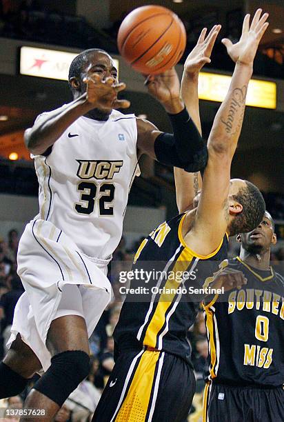 Central Florida guard Isaiah Sykes passes the ball against Southern Miss guard LaShay Page, right, during game action at UCF Arena in Orlando,...