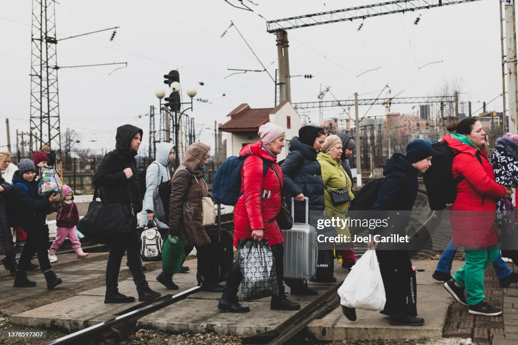 Ukrainians arriving at the train station in Lviv, Ukraine