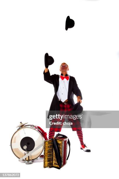 clown is juggling with hats - circus performer stock pictures, royalty-free photos & images