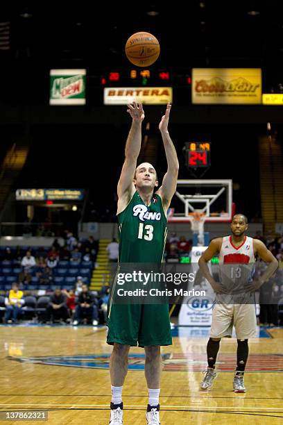 Blake Ahearn of the Reno Bighorns shoots what is his milestone one hundredth consecutive free throw as Preston Knowles of the Springfield Armor looks...