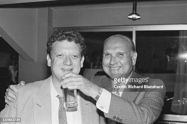 British film director Gerald Thomas with his nephew, producer Jeremy Thomas at the Cannes Film Festival, France, May 1984.