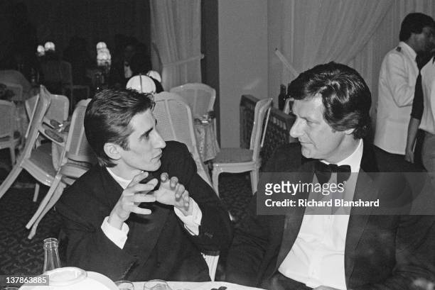 Irish actor John Lynch with director Pat O'Connor at the Cannes Film Festival, France, May 1984. They are there to present their film 'Cal'.
