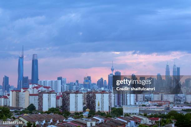 view of cloudy sunset over downtown kuala lumpur - kuala lumpur landscape stock pictures, royalty-free photos & images