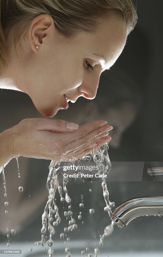 Woman washing face