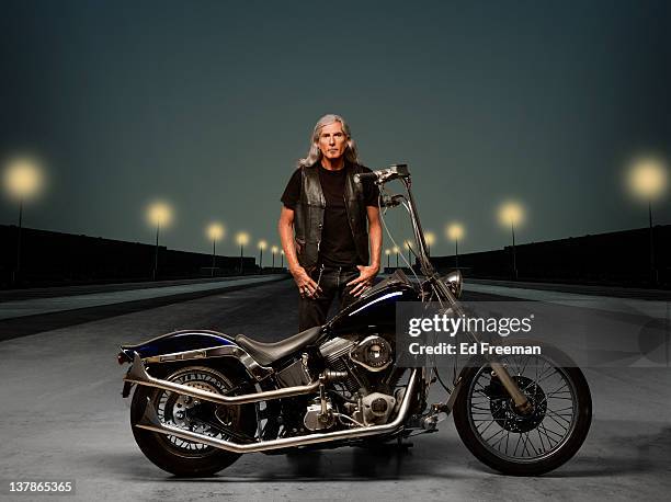 motorcycle rider with night background - motociclista fotografías e imágenes de stock