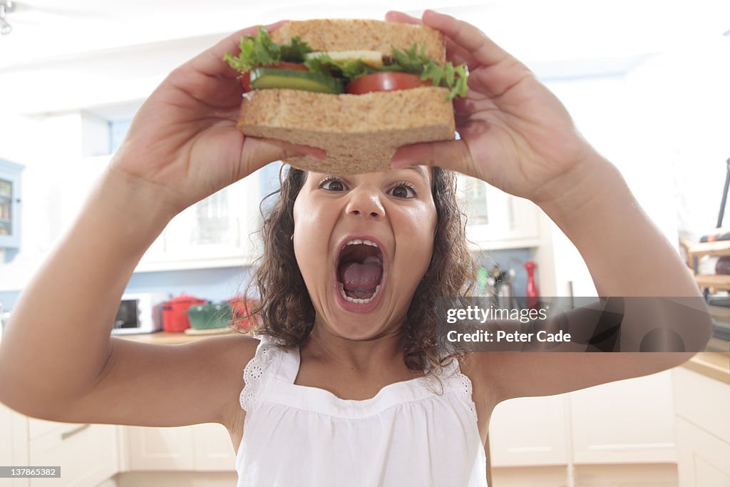 Young girls about to eat sandwich