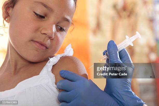 young girl having injection - children vaccination stock pictures, royalty-free photos & images