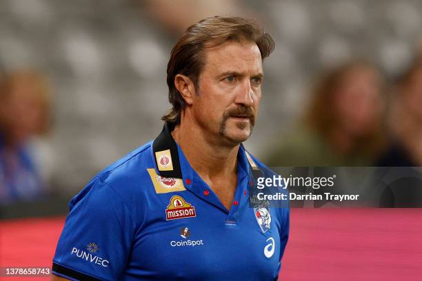 Luke Beveridge , Senior Coach of the Bulldogs looks on in the warm up before the AFL AAMI Community Series match between Western Bulldogs and the...