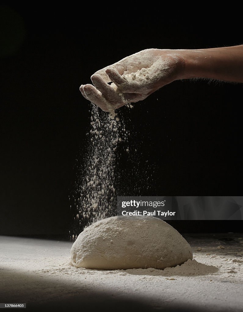 Sprinkling Flour on Dough