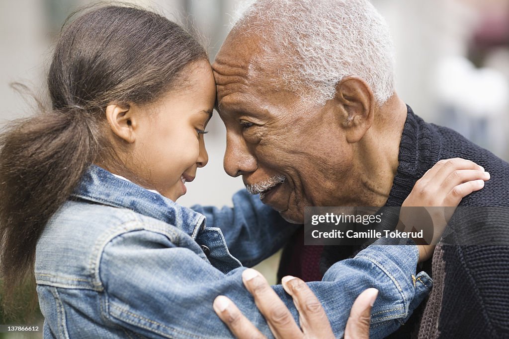 Grandfather and granddaughter face to face