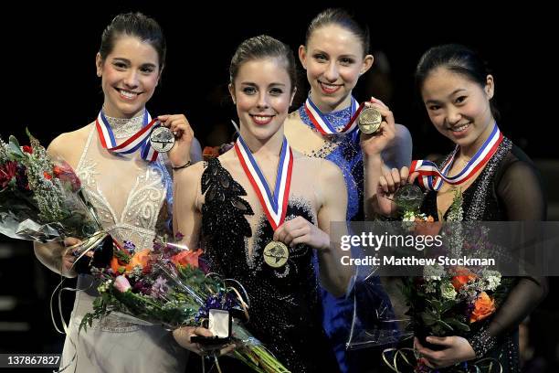 Alissa Czisny, Ashley Wagner, Agnes Zawadzki and Caroline Zhang pose for photographers on the medal's podium after the Ladies competition during the...