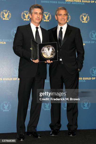 Director Alexander Payne , recipient of the Feature Film Nomination Plaque for 'The Descendants,' and presenter George Clooney pose in the press room...