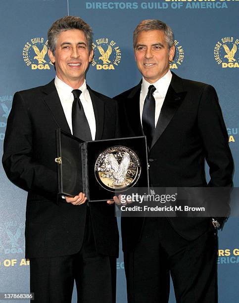 Director Alexander Payne , recipient of the Feature Film Nomination Plaque for 'The Descendants,' and presenter George Clooney pose in the press room...