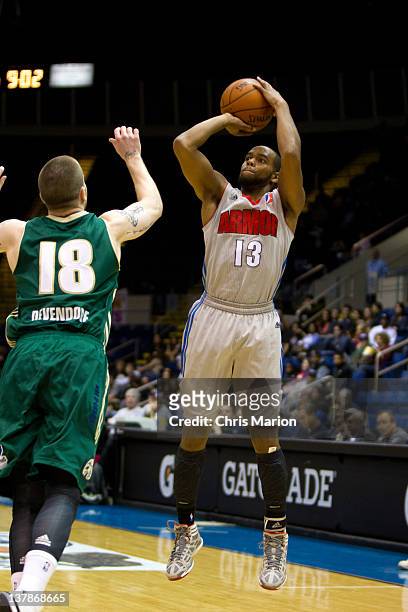 Preston Knowles of the Springfield Armor shoots from outside defended by Eric Devendorf of the Reno Bighorns at the MassMutual Center on January 28,...