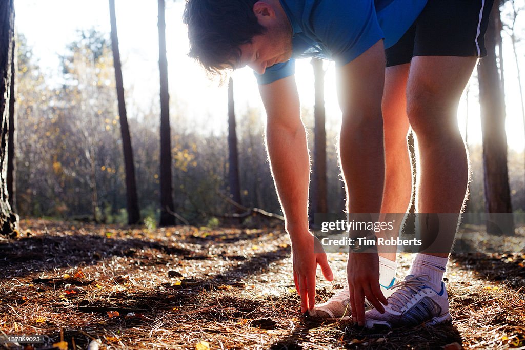 Male athlete warming up.