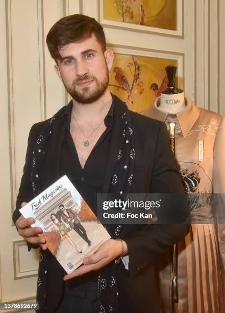 Influencer Yanis Bargoin poses with his “Fresh Magazine” during the Verger Freres and YOXEONE presentation at 207 Saint Honoré on March 03, 2022 in...