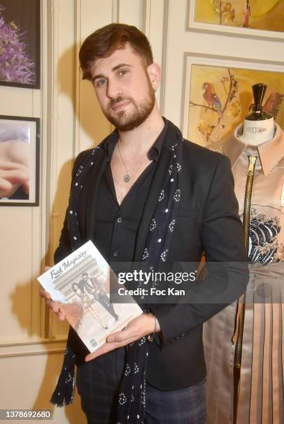 Influencer Yanis Bargoin poses with his “Fresh Magazine” during the Verger Freres and YOXEONE presentation at 207 Saint Honoré on March 03, 2022 in...
