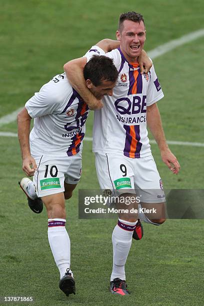 Liam Miller and Shane Smeltz celebrate after Miller scored a goal during the round 17 A-League match between Adelaide United and Perth Glory at...